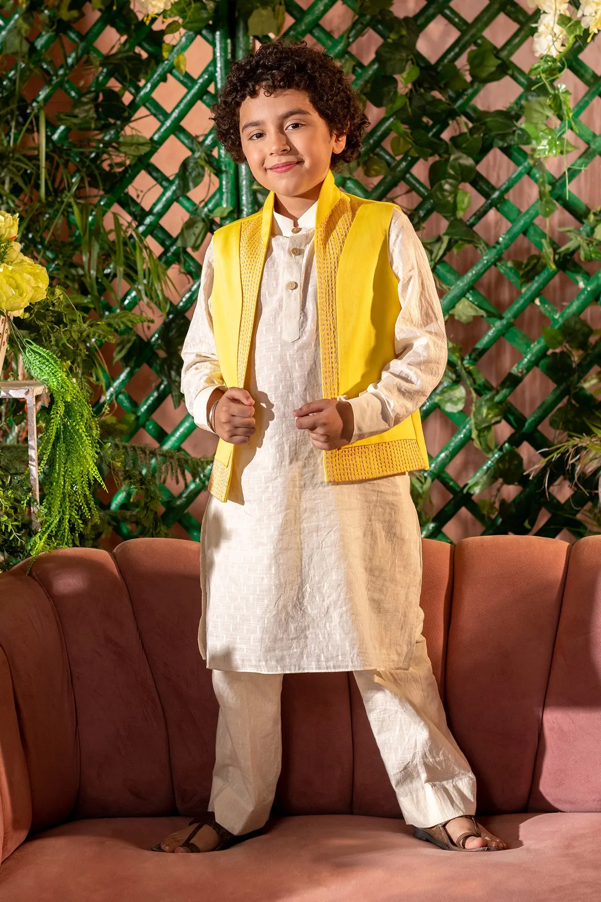 Qanari  -

 Embroidered  

Yellow Nehru Jacket Paired With Cream Kurta & Trouser Set